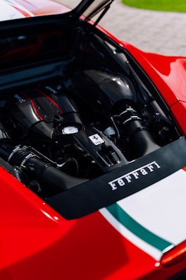 An elegant Ferrari engine being serviced.