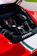 Close-up of a shiny red Ferrari engine with new Rossoveloce parts installed.