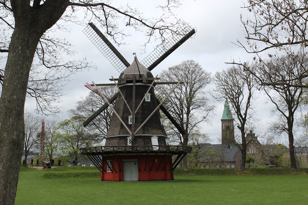 brown and red wooden windmill