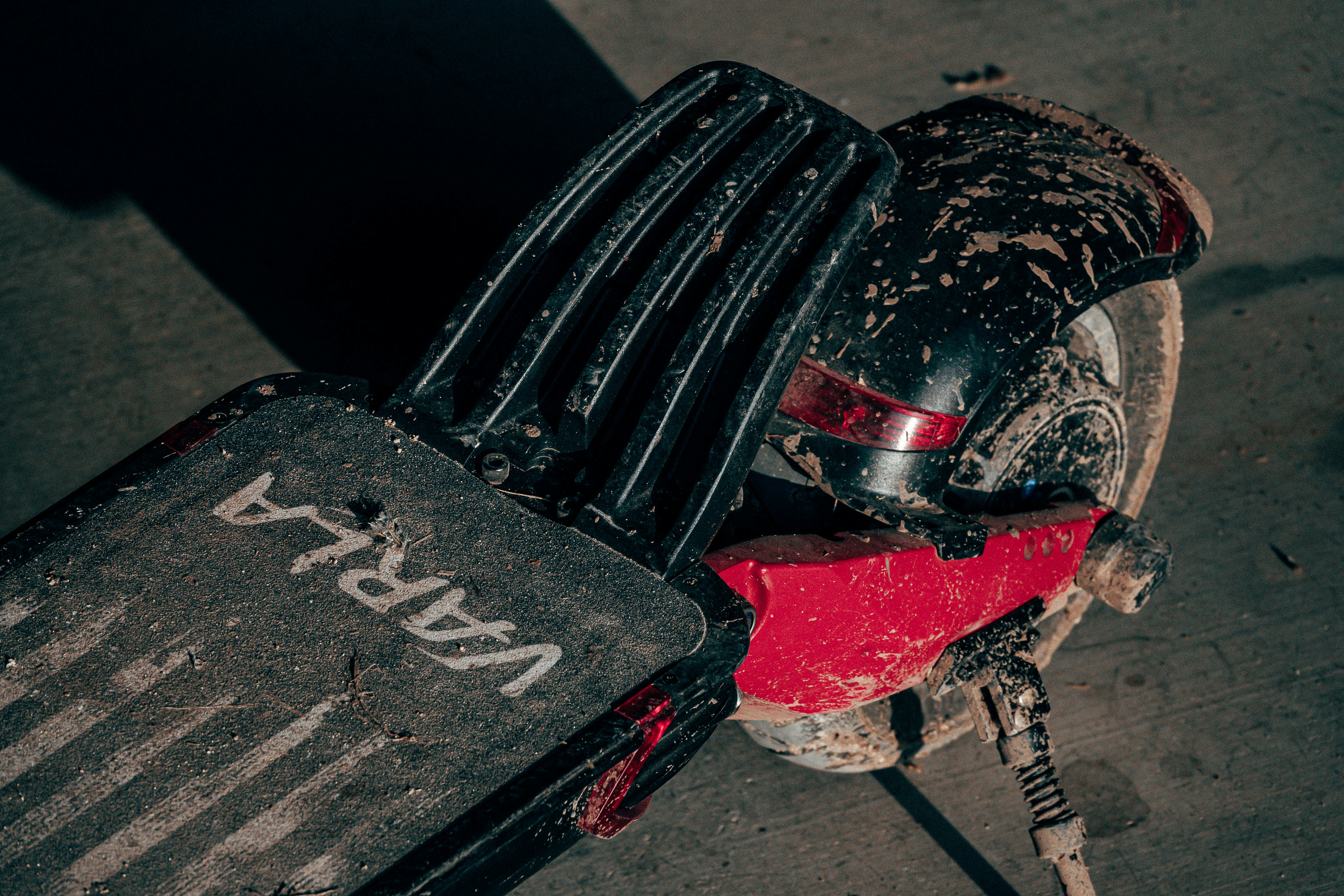 black and red motorcycle on gray concrete floor