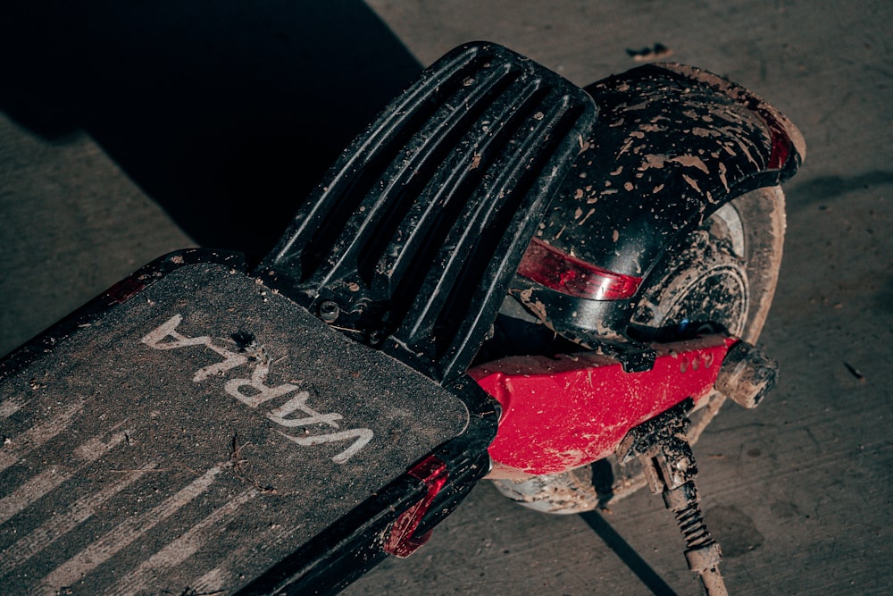 black and red motorcycle on gray concrete floor