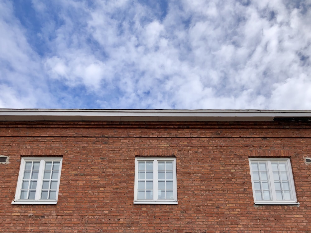 brown brick building under blue sky