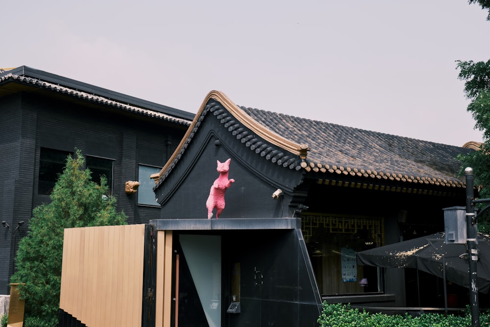 brown wooden house with red roof