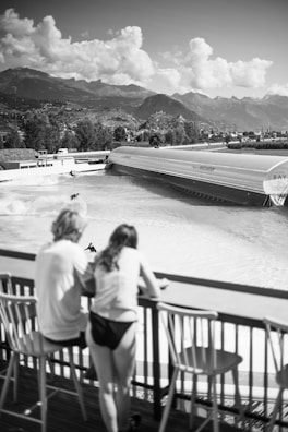 A wide view of a wave pool filled with swimmers and waves.