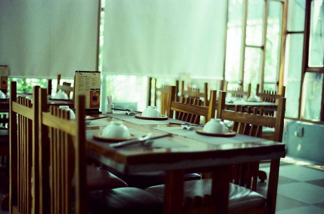 brown wooden table with chairs