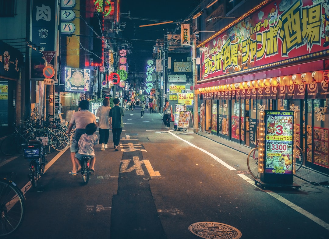 people walking on street during night time