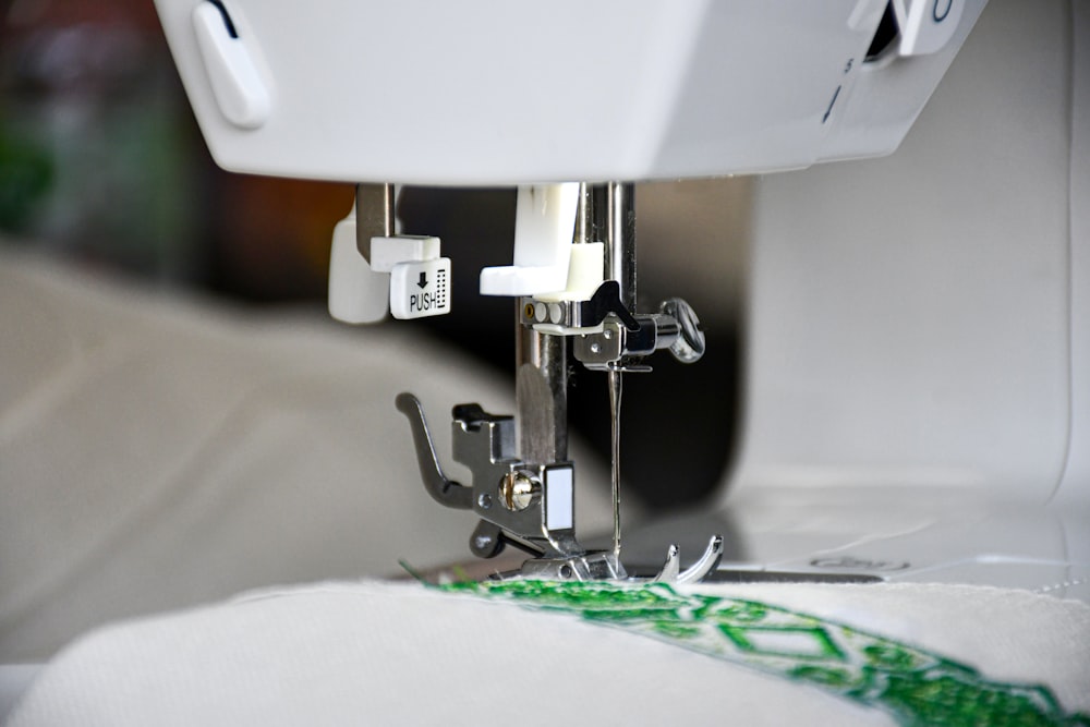 white sewing machine on white table