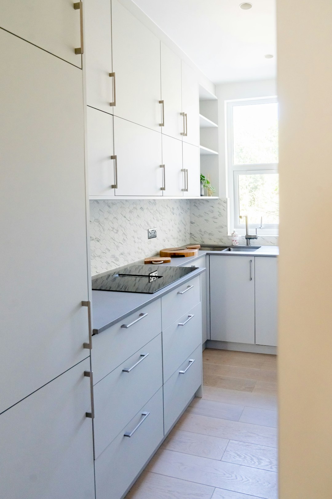 white wooden kitchen cabinet near white wall
