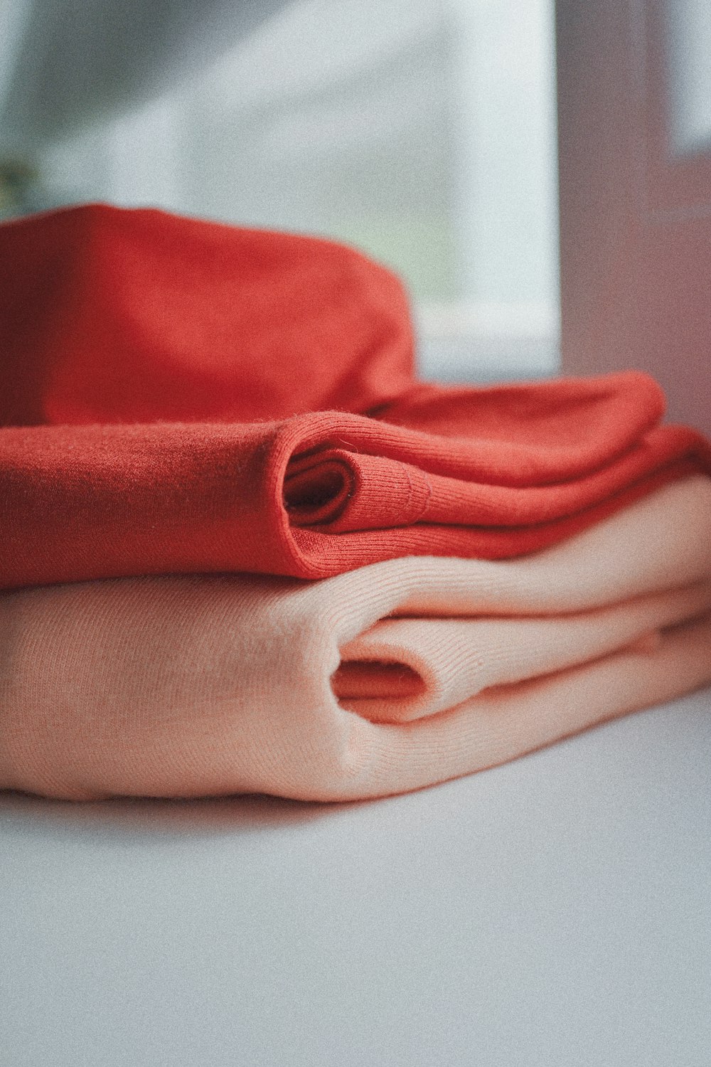 pink textile on white table