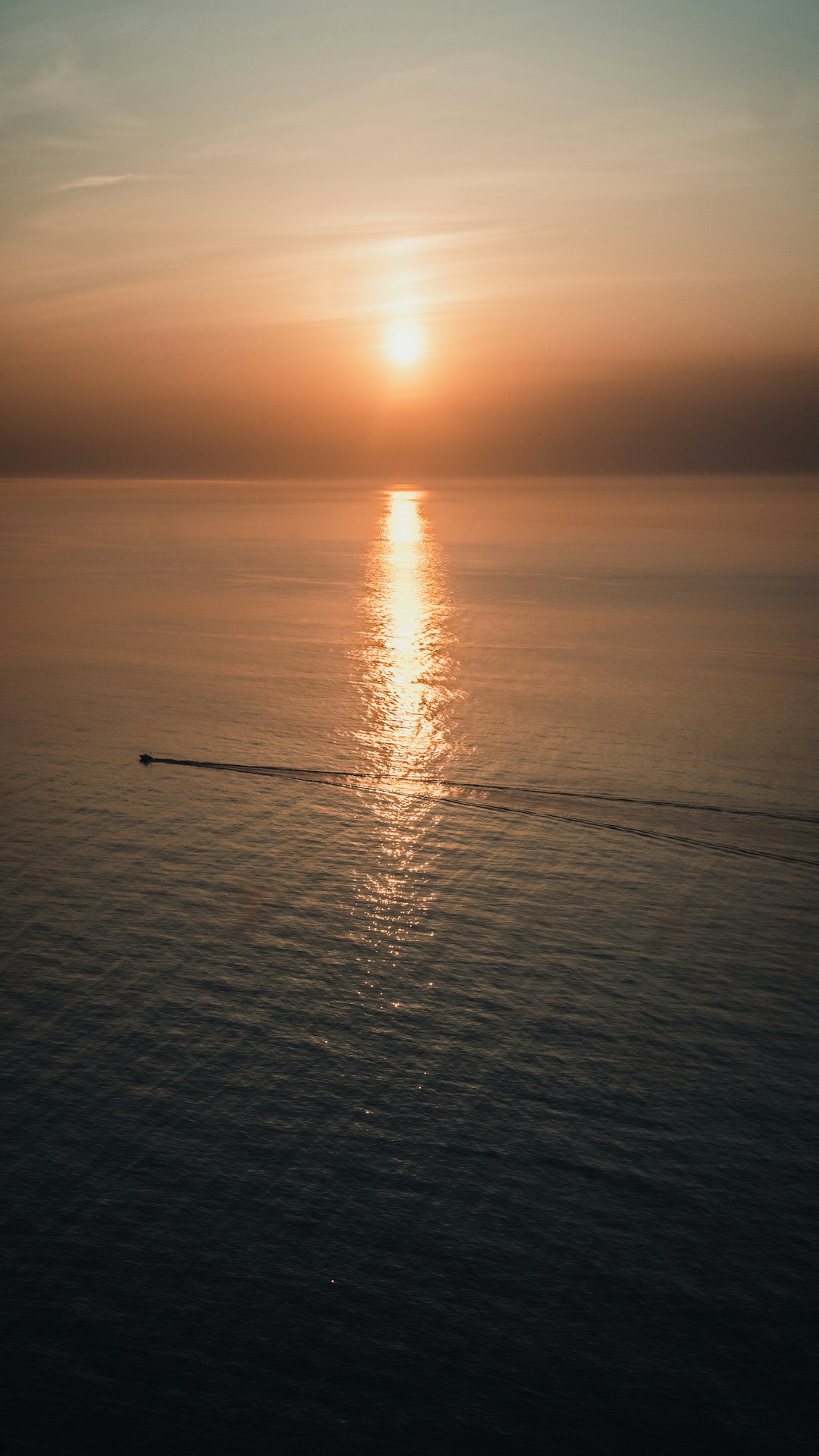 body of water during sunset