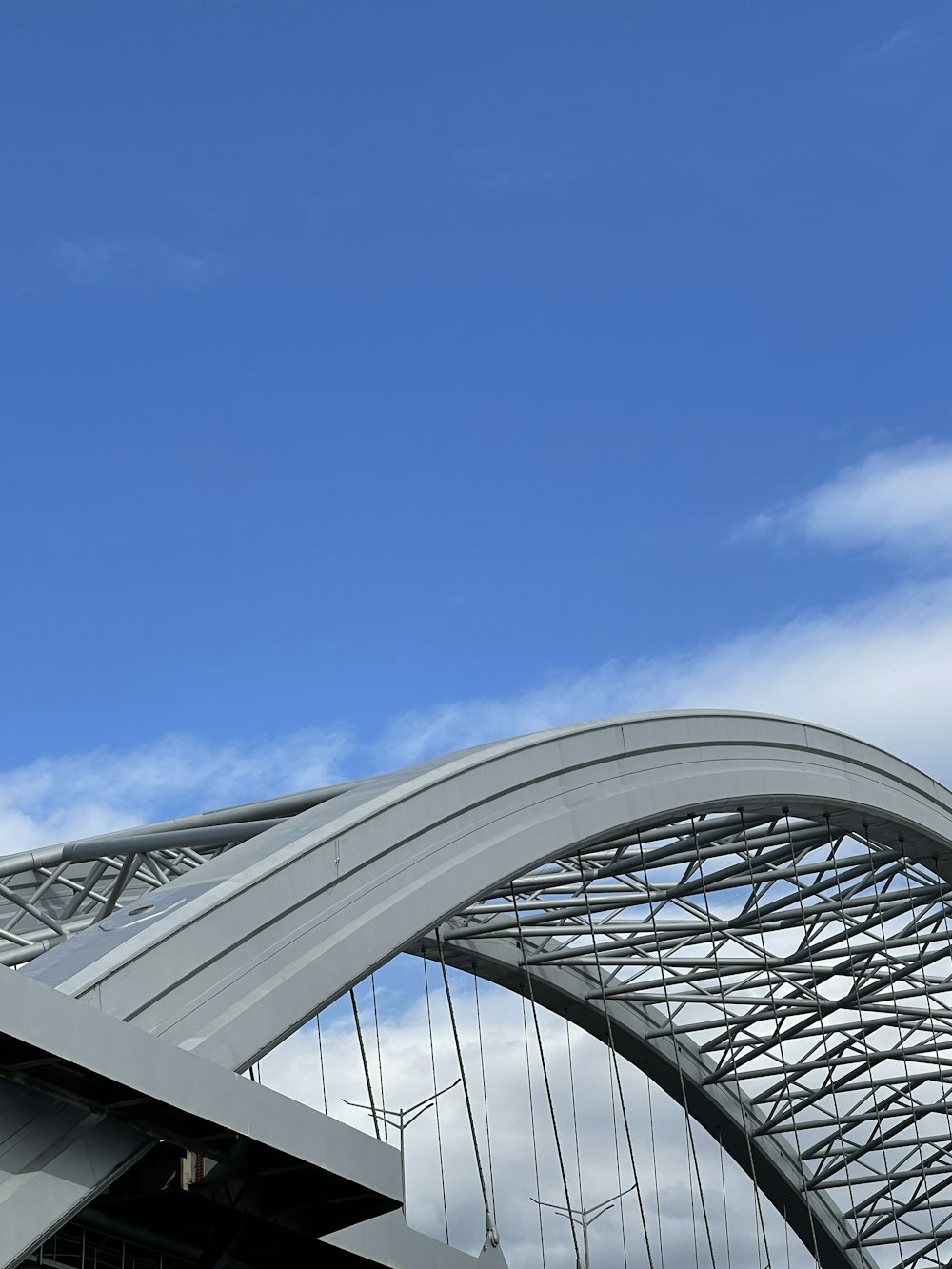 gray metal frame under blue sky during daytime