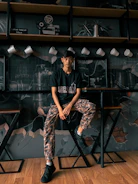 A confident male influencer sharing lifestyle tips in a modern Melbourne cafe.