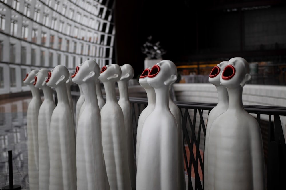 white ceramic figurine on black metal rack