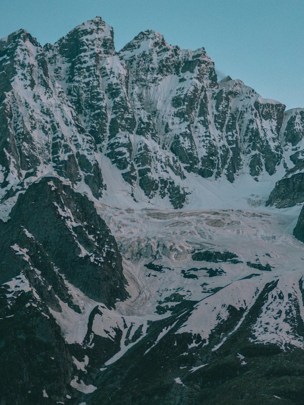 snow covered mountain during daytime