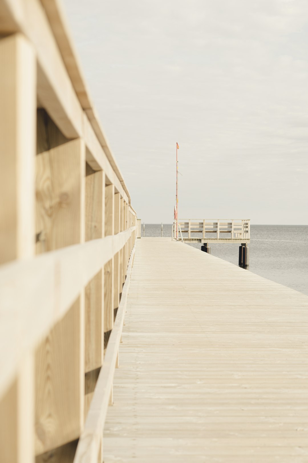 white wooden dock on sea during daytime