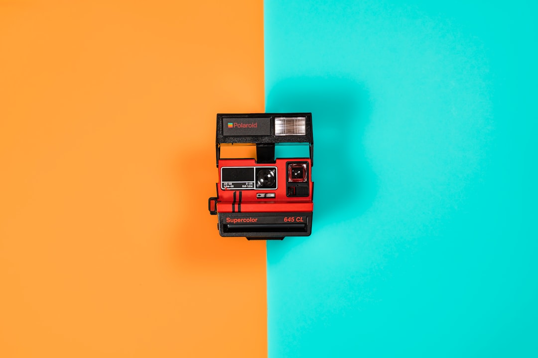 black and red polaroid camera