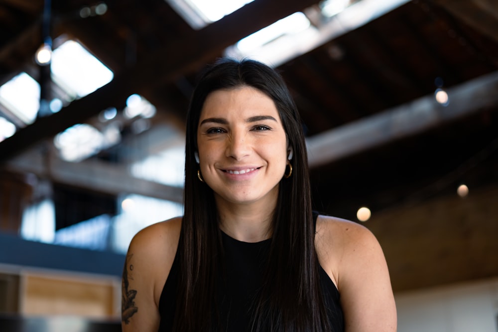 smiling woman in black tank top