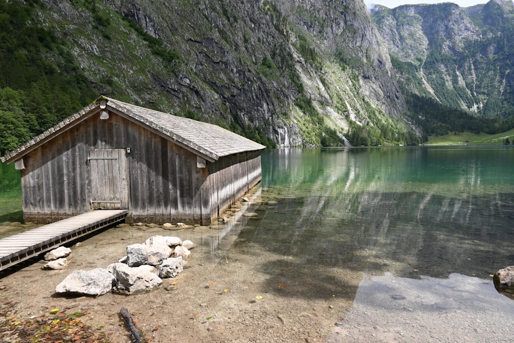 brown wooden house on lake