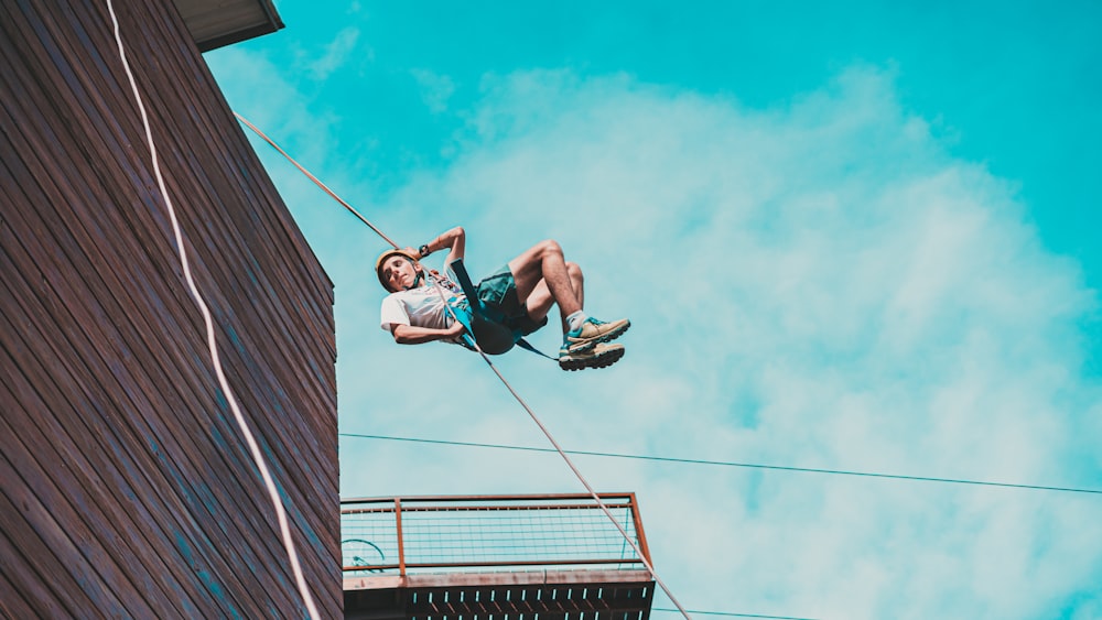 a man on a rope high up in the air