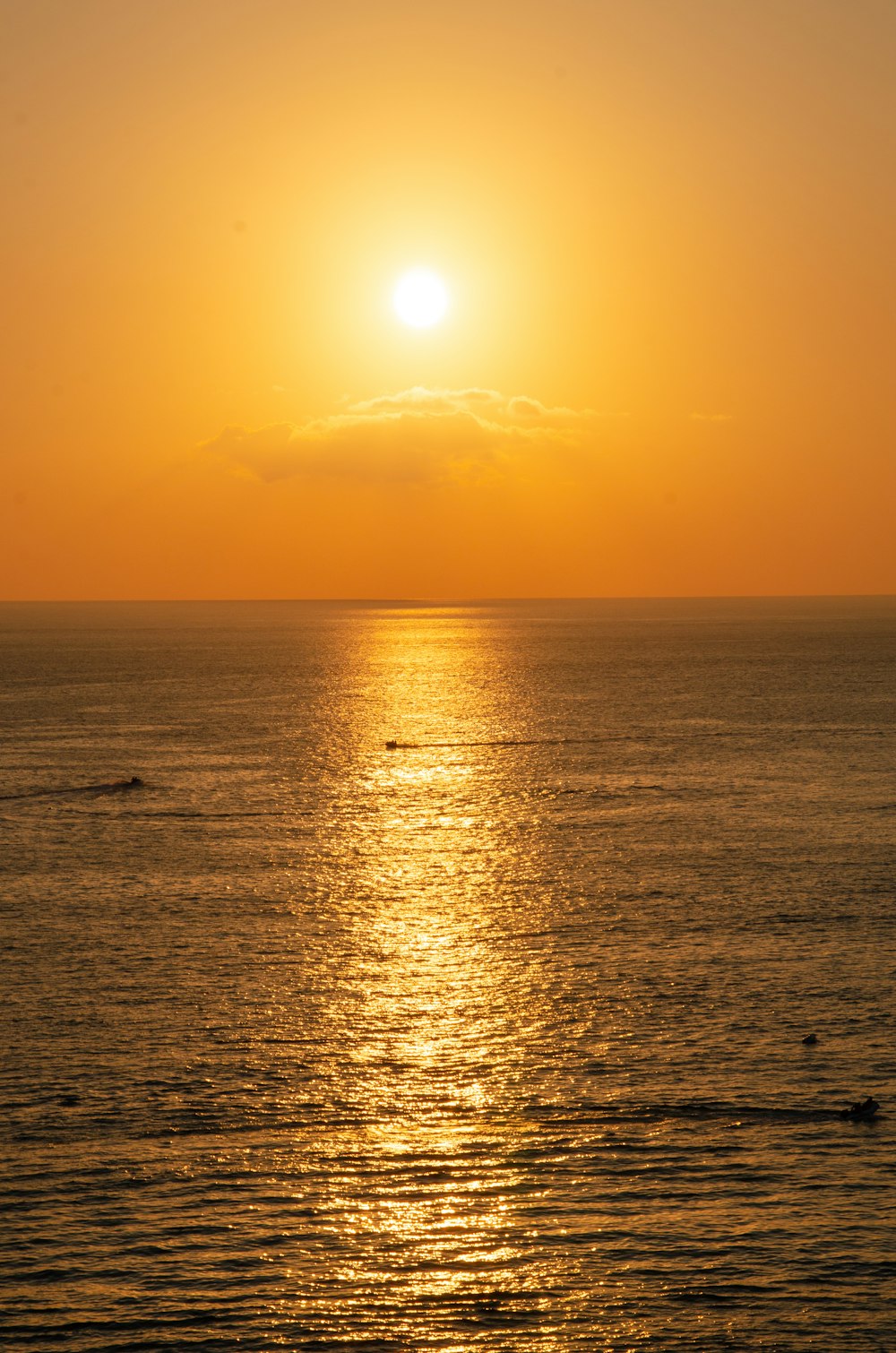 body of water during sunset