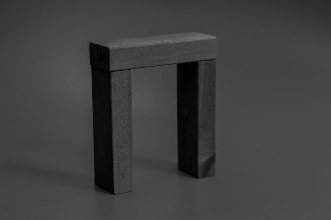 gray concrete pillar on white table