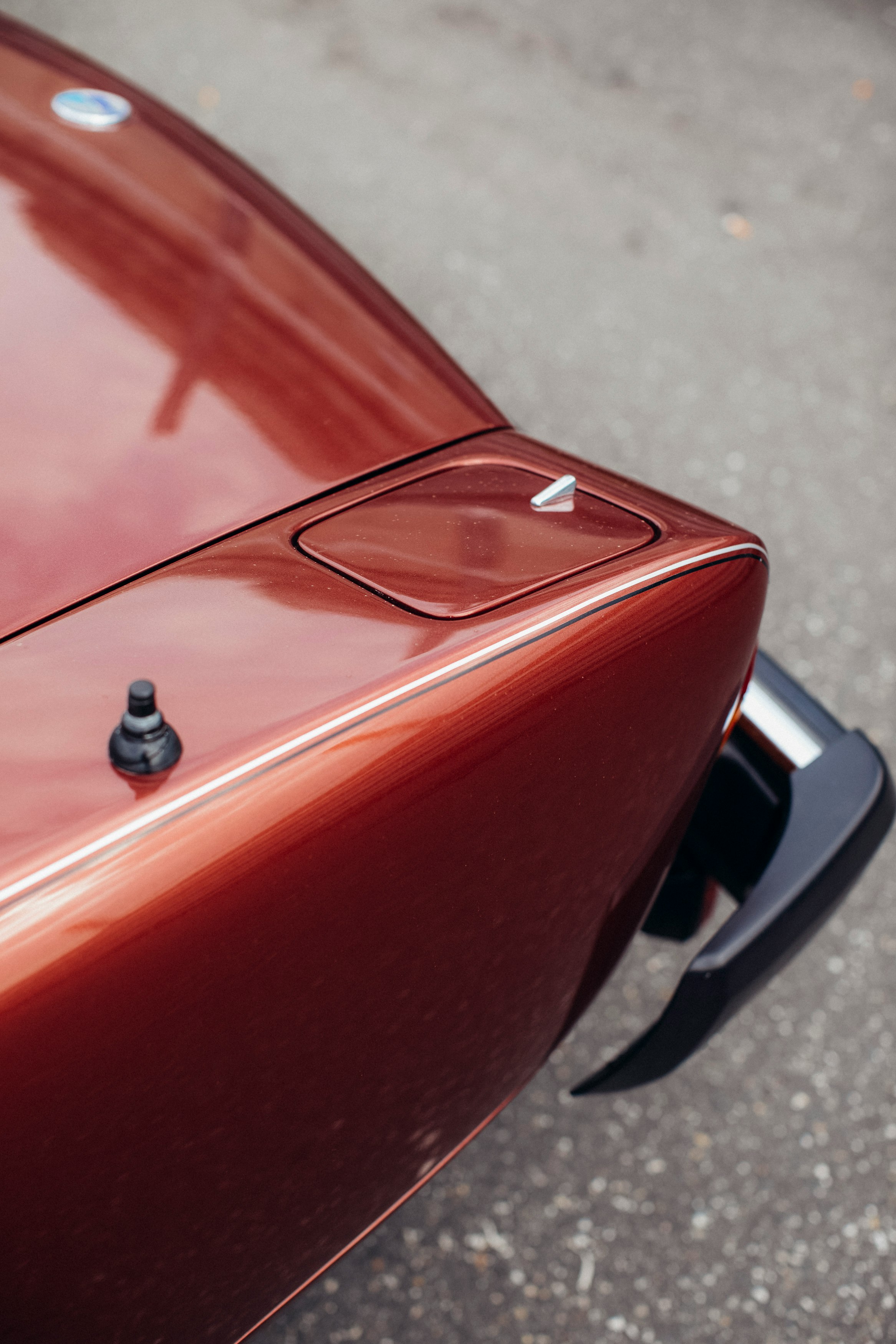 red car with black door lever