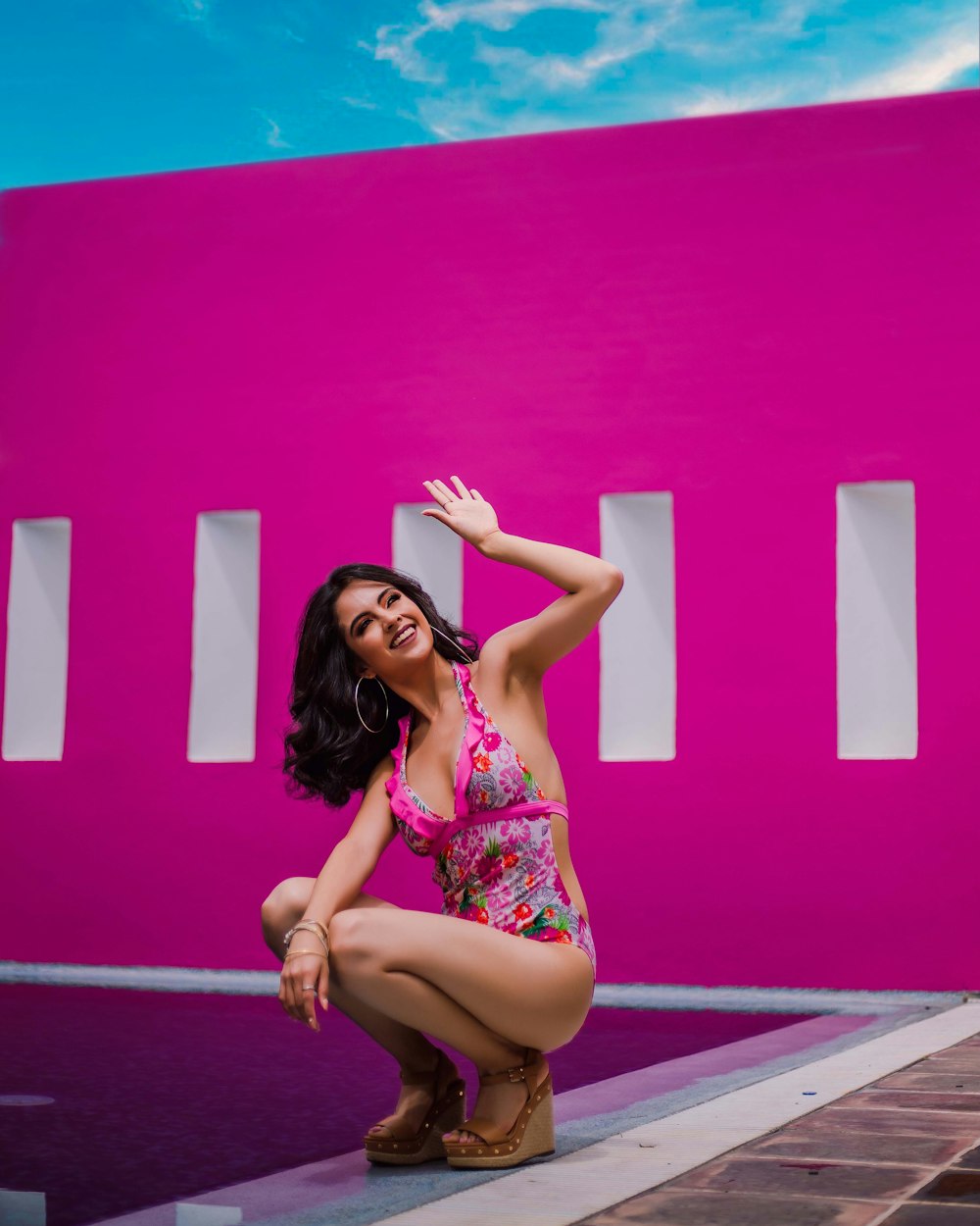 woman in pink and white floral bikini set