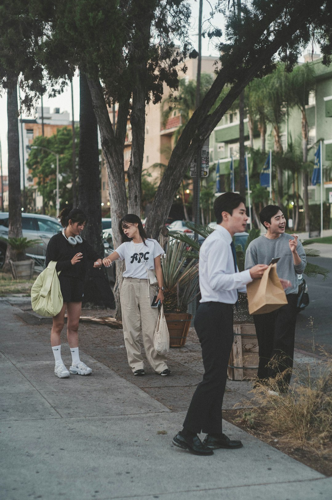 group of people standing on gray concrete floor during daytime