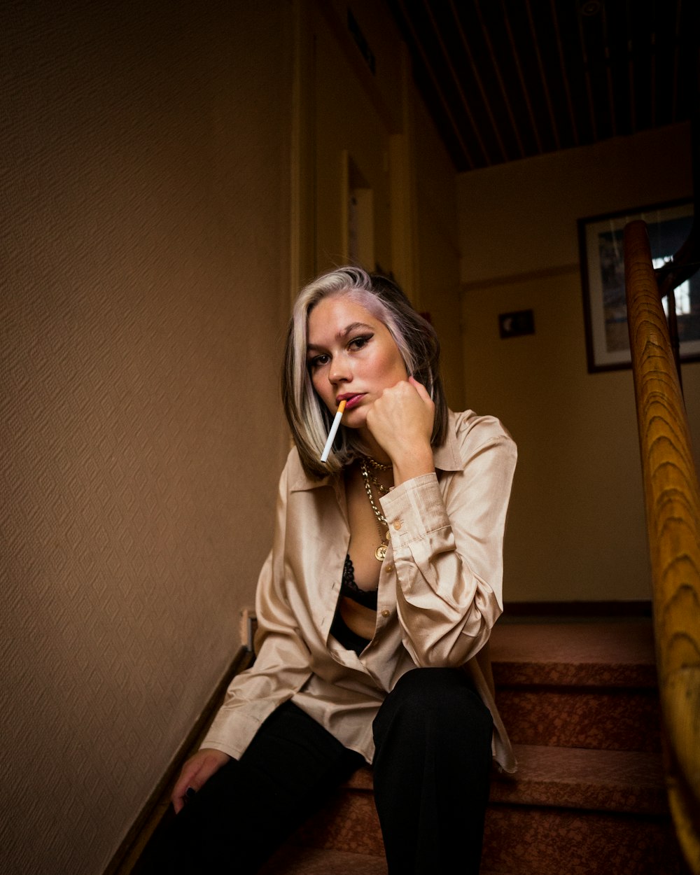 woman in beige coat sitting on chair