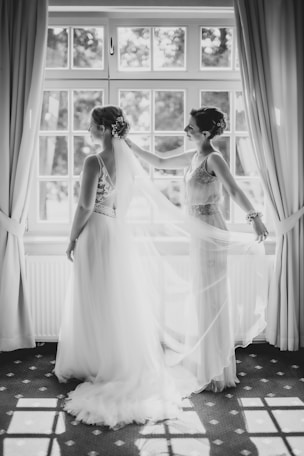grayscale photo of woman in wedding dress