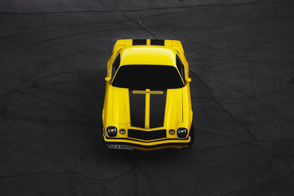 yellow lamborghini aventador on black asphalt road