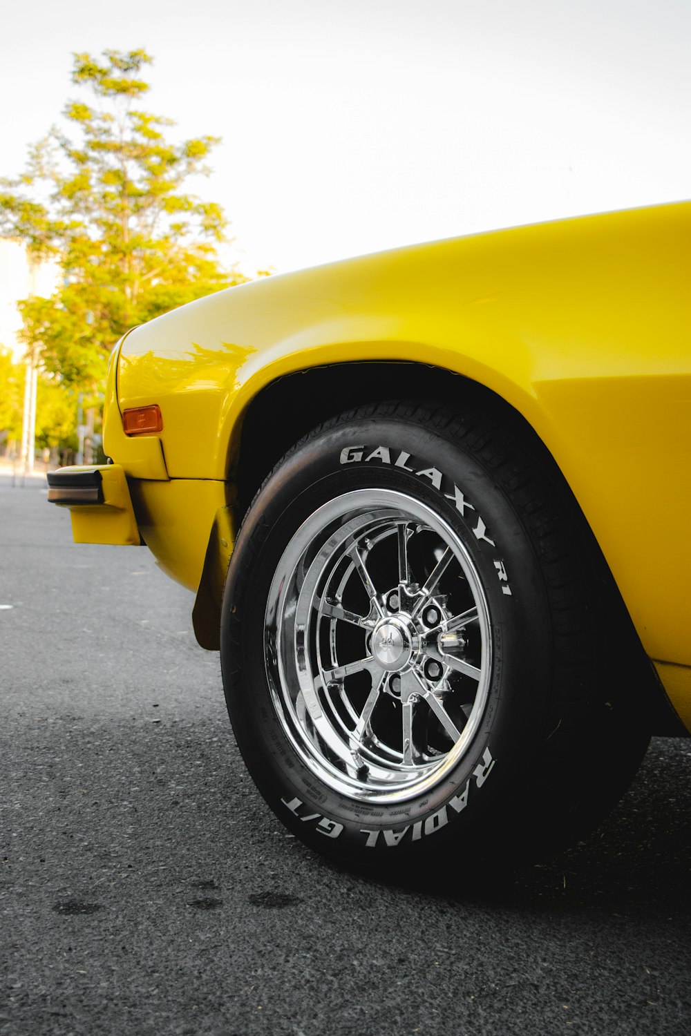 yellow car with black wheel