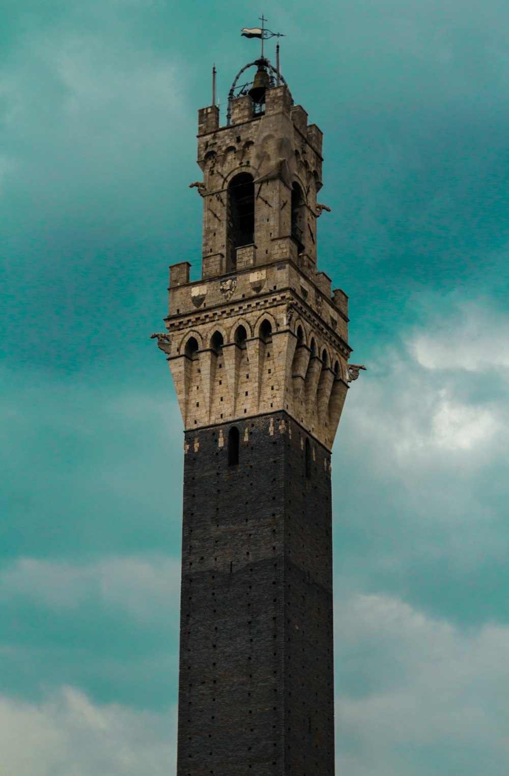 brown concrete tower under blue sky