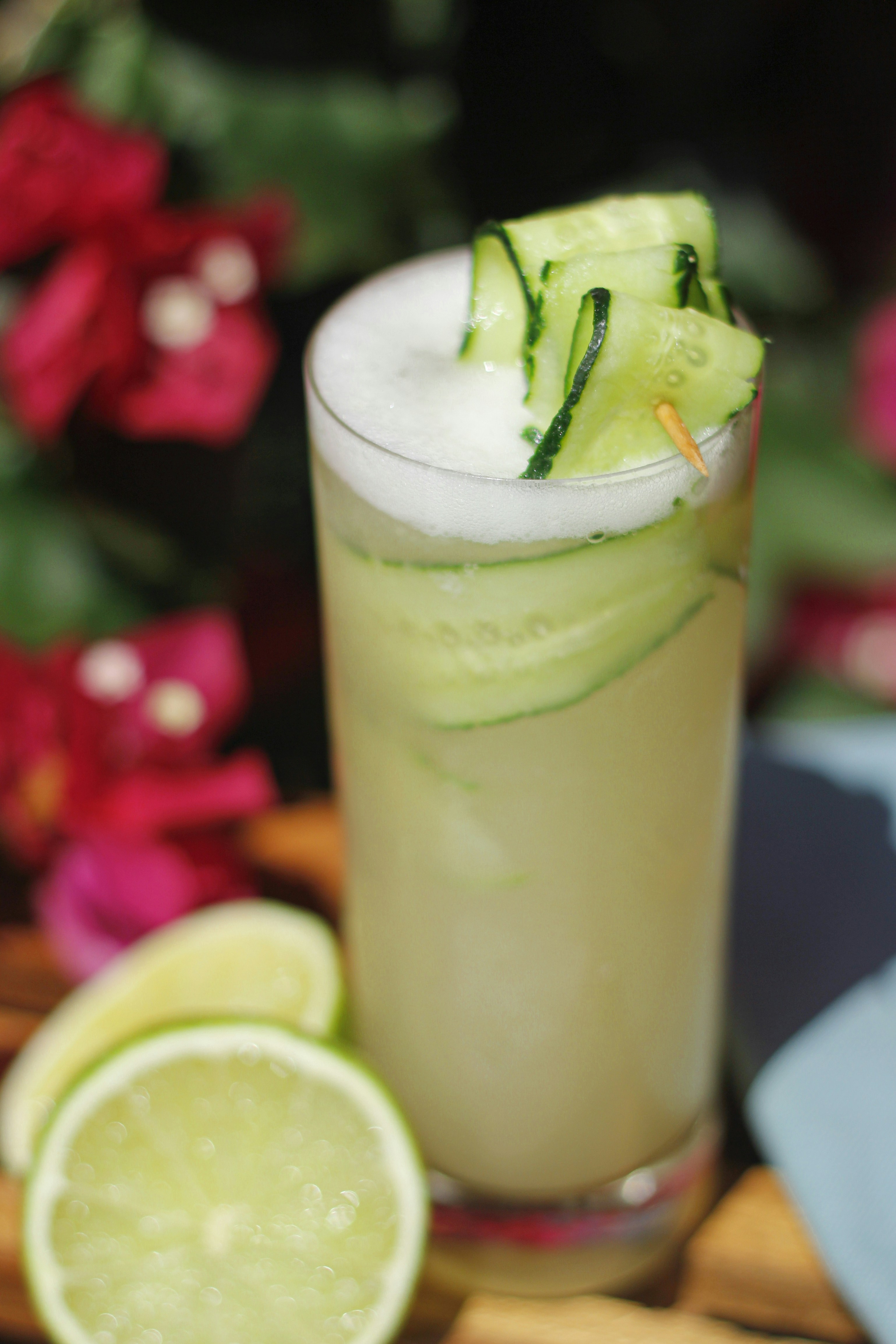 clear drinking glass with green liquid and sliced lemon