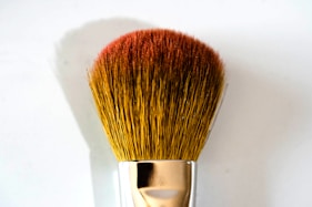 brown and silver makeup brush