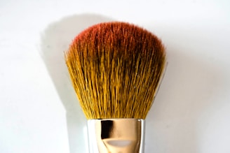 brown and silver makeup brush