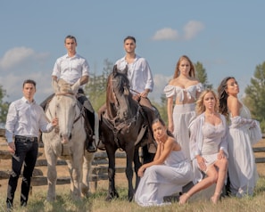 Group photo of Aragon Stable team celebrating their recent victory with horses