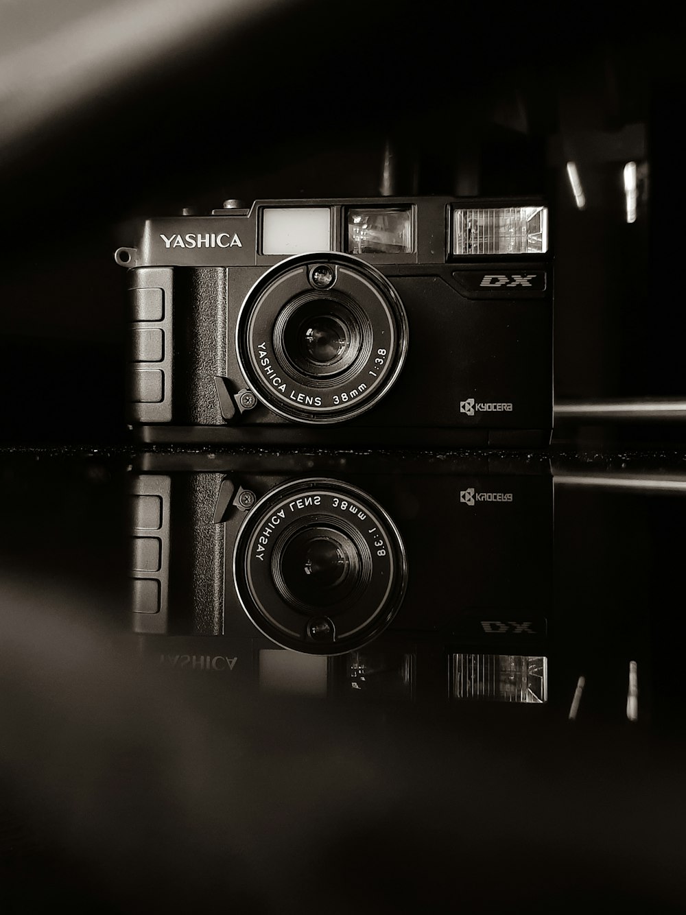 black and silver camera on white surface