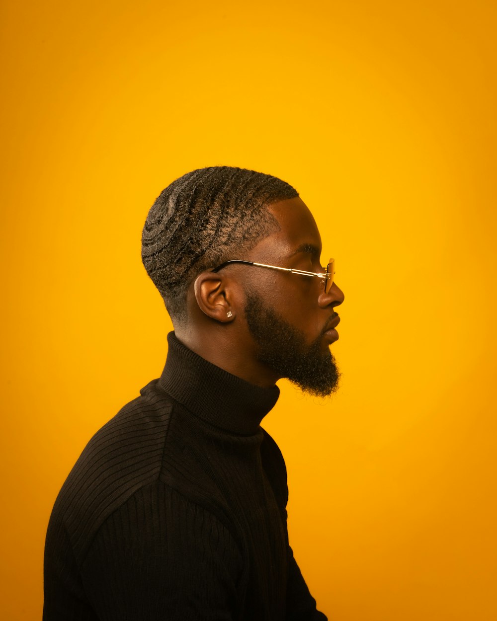 man in black sweater wearing black framed eyeglasses