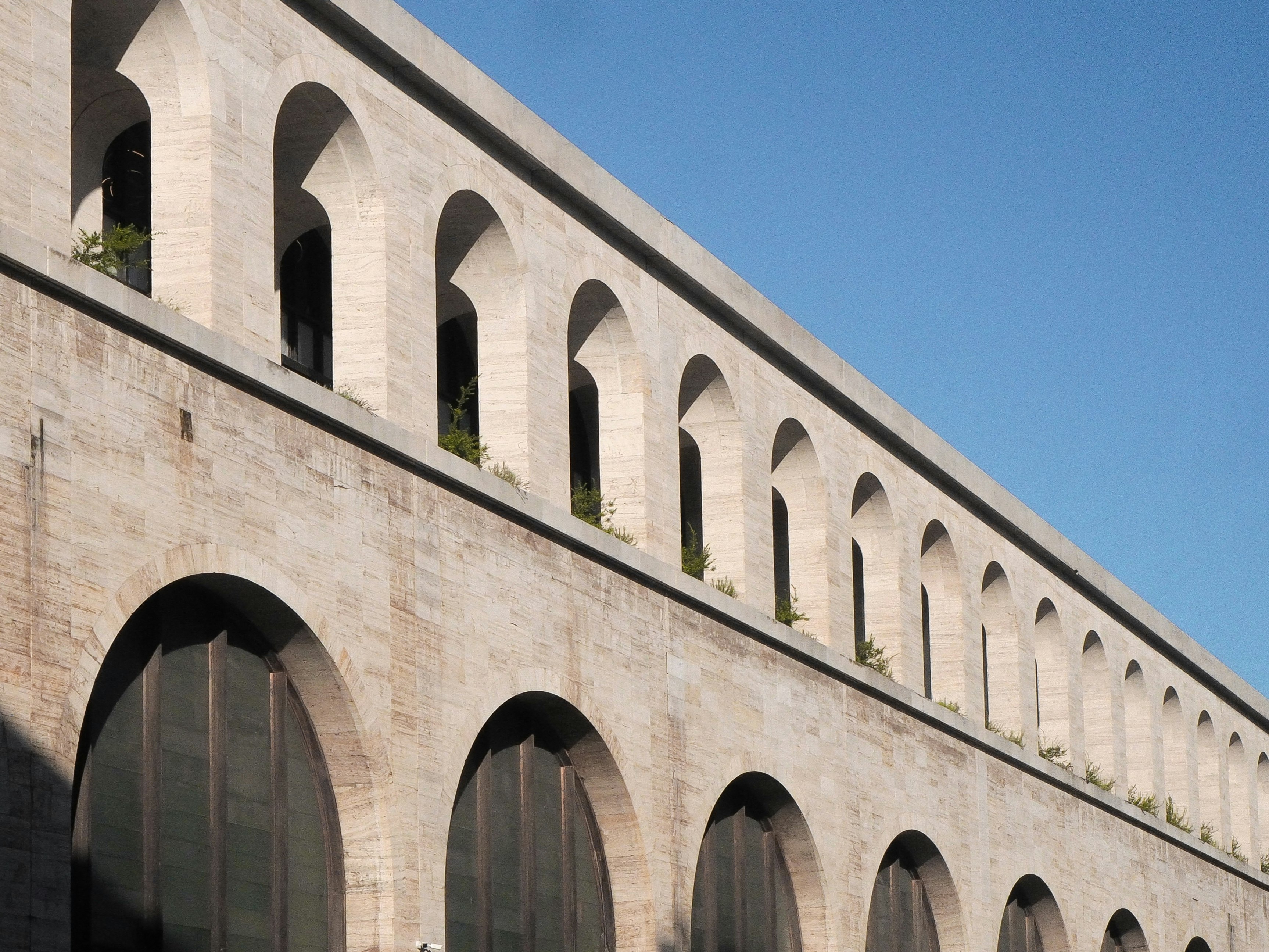 gray concrete bridge under blue sky during daytime