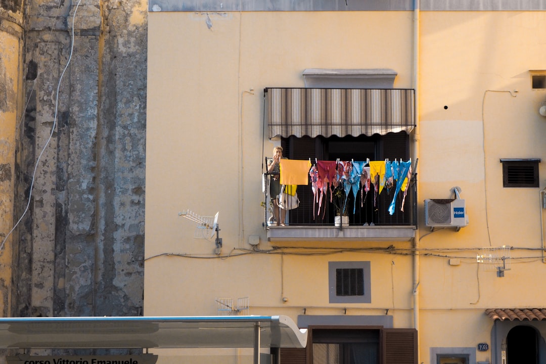 clothes hanged on window during daytime