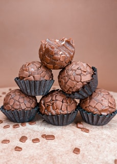 chocolate cupcakes on white textile