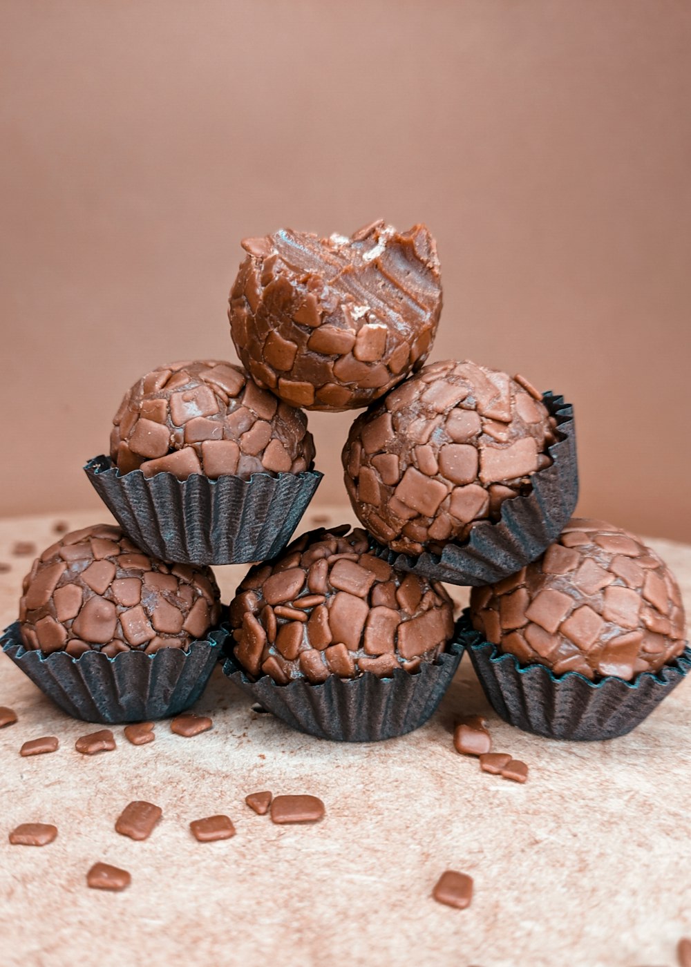 chocolate cupcakes on white textile