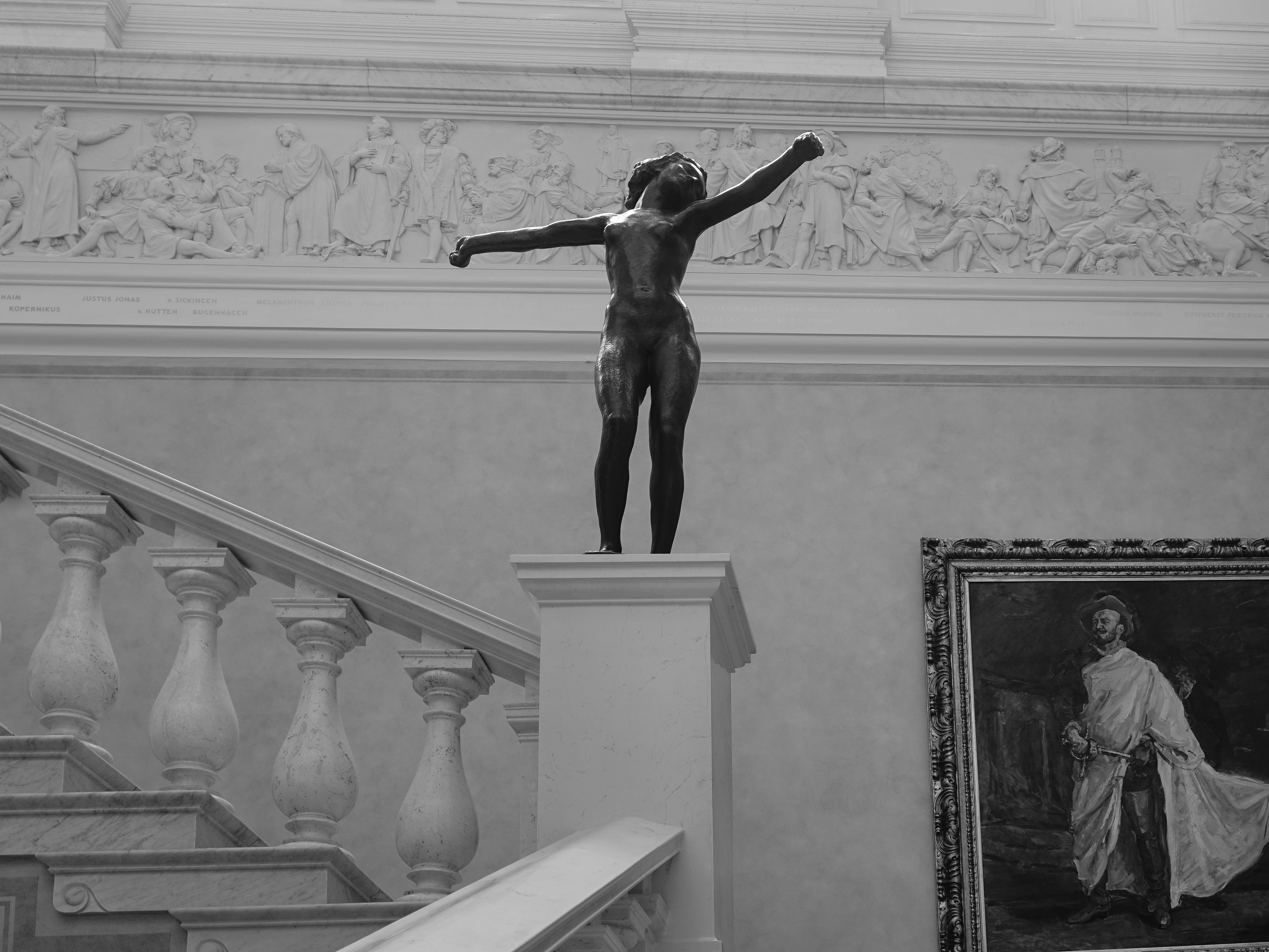 man in black pants statue