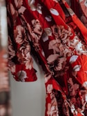 red and white floral textile
