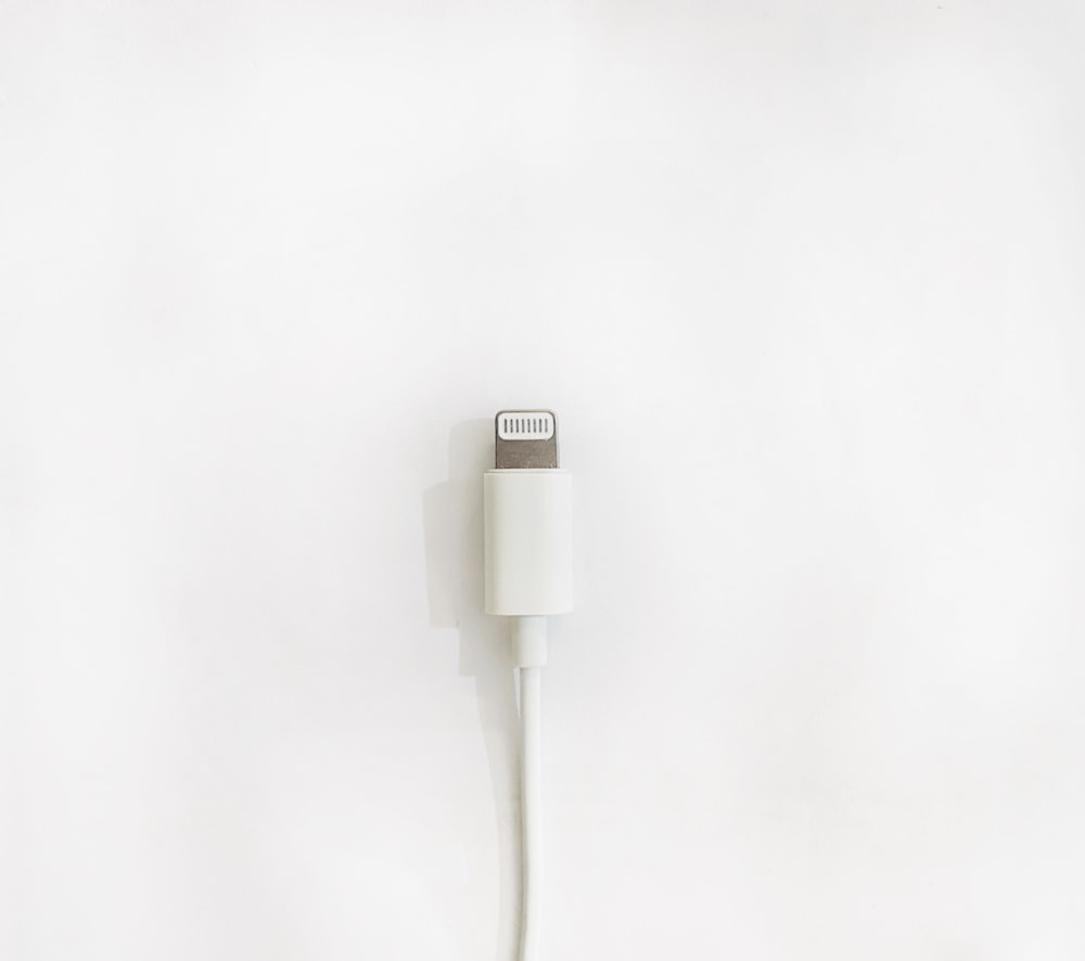 white usb cable on white surface