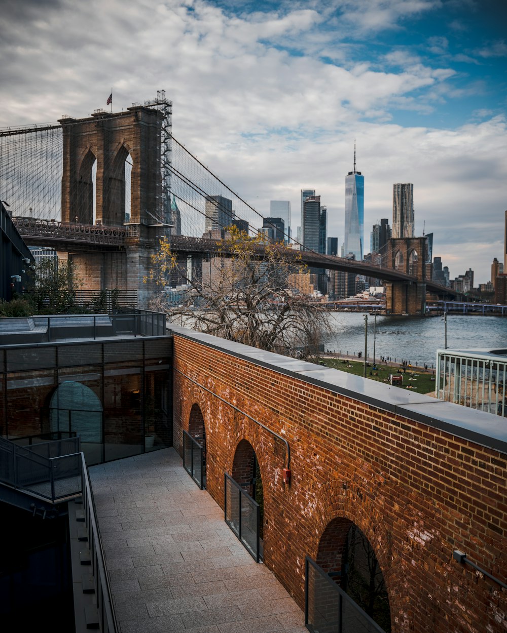 brown and gray bridge over river during daytime