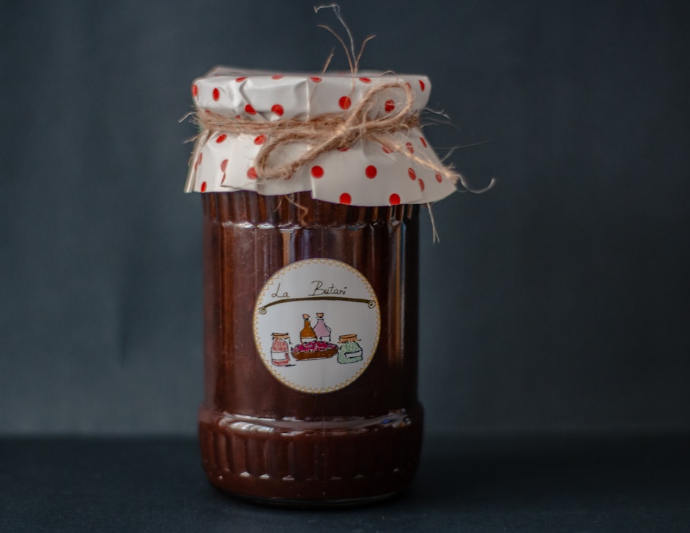 brown and white labeled jar