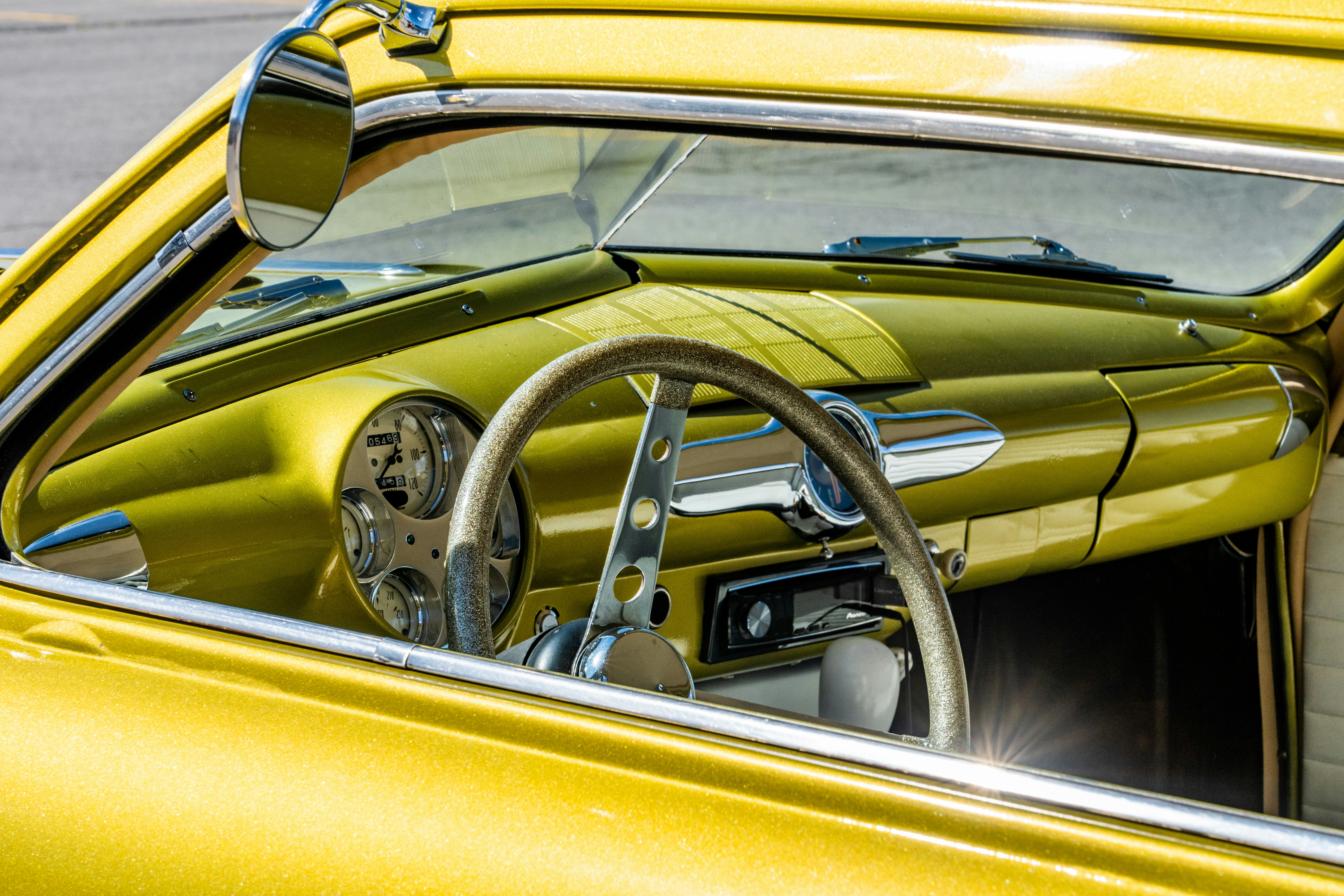 Vintage car steering wheel and dashboard