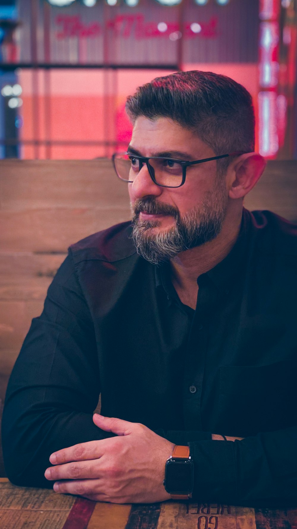 man in black button up shirt wearing eyeglasses